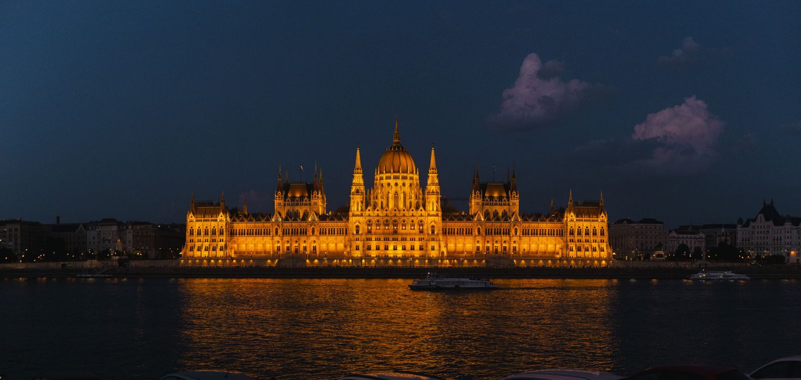 Hungarian Parliament lit at night and reflected in the Danube in Budapest